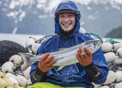 Fisherman Holding Salmon