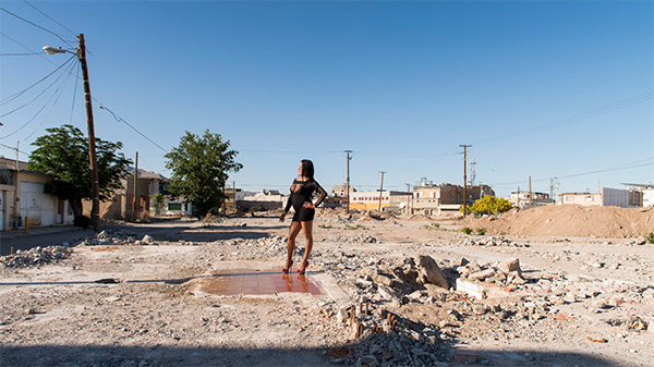 TERESA MARGOLLES_Pista de Baile de la discoteca Virginias_2016_Color print on cotton paper _Transgender sex worker standing on the dance floor of a demolished club in Ciudad Juárez, Mexico_125 x 185 cm TERESA MARGOLLES_Pista de Baile de la discoteca Virginias_2016_Color print on cotton paper _Transgender sex worker standing on the dance floor of a demolished club in Ciudad Juárez, Mexico_125 x 185 cm