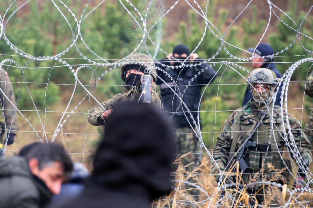 migrants on the border between poland and belarus