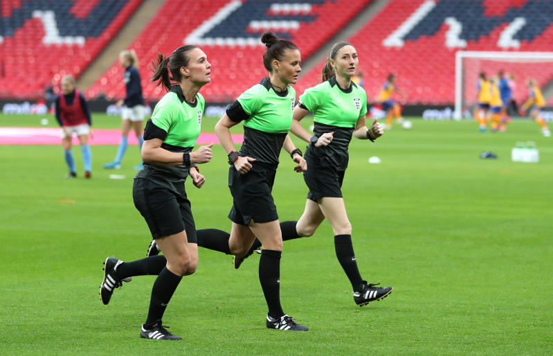 Referee Rebecca Welch (centre), Sian Massey Ellis (right) and Natalie Walker