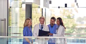 multi-cultural-medical-team-wearing-white-coats-an-2024-10-19-10-23-09-utc