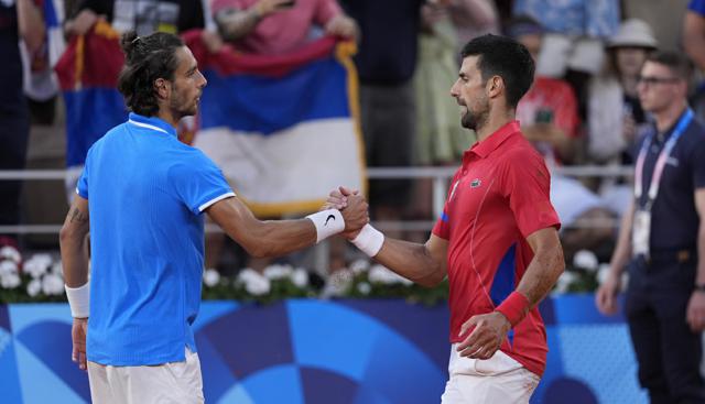 Novak Djokovic e Lorenzo Musetti - foto Lapresse Novak Djokovic e Lorenzo Musetti - foto Lapresse