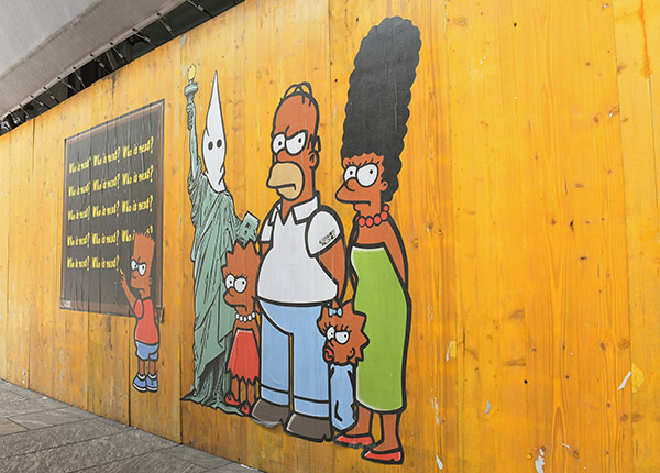 AleXsandro Palombo street artist con i Simpson ricorda George Floyd a Milano AleXsandro Palombo street artist con i Simpson ricorda George Floyd a Milano