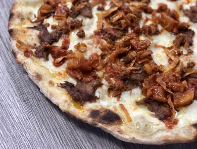 La pizza al patanegra di Briatore? Gli offriamo la nostra “maiale e ananas”!