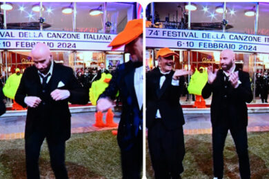 Amadeus smascherato su Travolta. “Don’t worry be happy”, solo un caso?