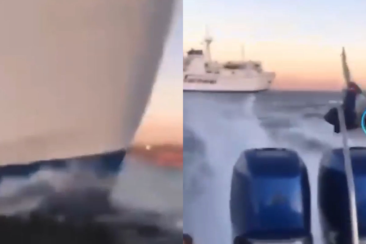 Napoli, scena da film: motoscafo taglia la strada a un traghetto nel canale di Procida Napoli, scena da film: motoscafo taglia la strada a un traghetto nel canale di Procida